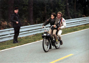 Steve Mac Queen with his son on a solex 3800