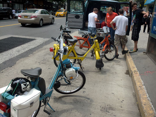 Steve and Steve's moped crew filling up their fuel tanks